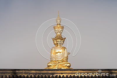 Gold buddha in foggy background Stock Photo