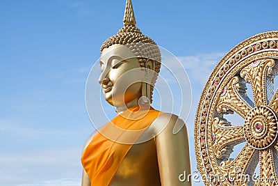 Gold buddha statue in Thai temple with clear sky.WAT MUANG, Ang Thong, THAILAND. Stock Photo