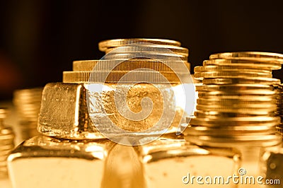 Gold bullions and stack of coins. Background for finance banking concept. Trade in precious metals. Stock Photo