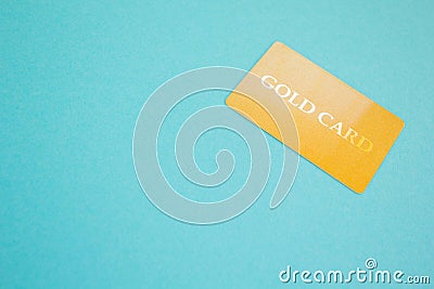 Gold card on a blue background, concept. Space for text Stock Photo