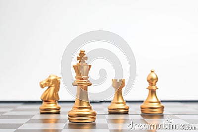 Gold Chess on chess board game for business metaphor leadership Stock Photo