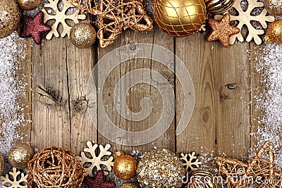 Gold Christmas ornament double border with snow frame on wood Stock Photo