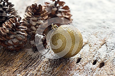 Gold Christmas Ornament Pinecones on wooden background Stock Photo