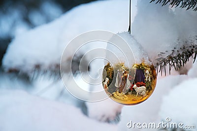Gold Christmas Tree Ornament Reflects Nativity Sce Stock Photo