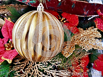 Gold Christmas tree ornaments decorate the Christmas tree to welcome Christmas Stock Photo