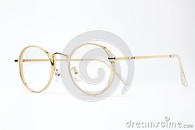 Gold classic round glasses on white background Stock Photo