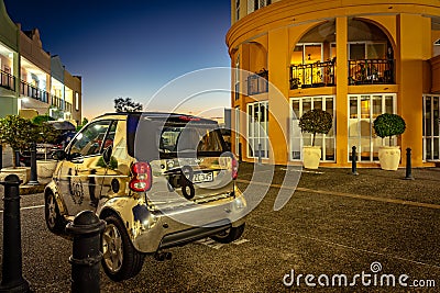 Gold Coast, Queensland, Australia - Shiny silver Smart Fortwo car with a fake winding key at the back Editorial Stock Photo