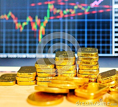 Gold coins, gold bars, sorting, concept, saving, education, gold investment Forex trading, stock table background blur Stock Photo