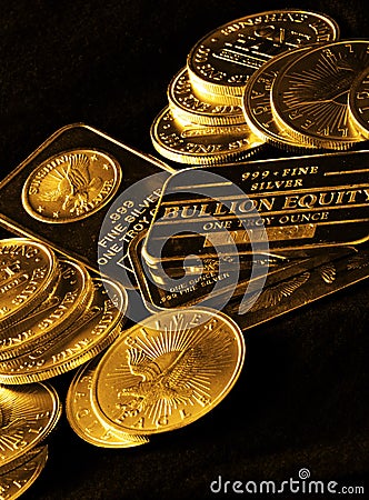 Gold Coins and Bars for Wealth Stock Photo