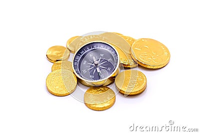 Gold coins and compass, business and travel concept. Stock Photo