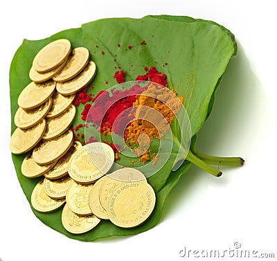 Gold coins kept on betel leaf Stock Photo