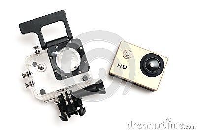 A gold colored small high definition HD action camera with a water proof kit case Stock Photo