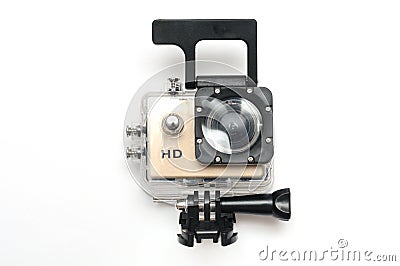 A gold colored small high definition HD action camera in a water proof kit case Stock Photo