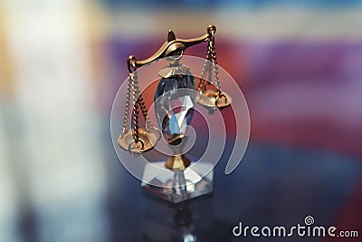 Gold Crystal justice scales macro background Stock Photo