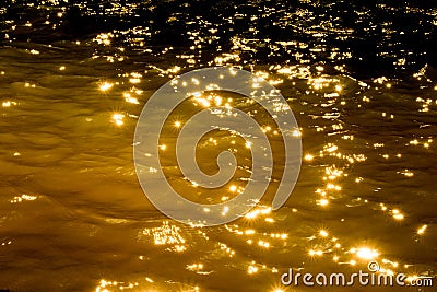 Gold dark water texture. Abstraction liquid metal. Stock Photo