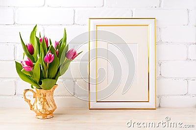 Gold decorated frame mockup with pink tulips in jug Stock Photo