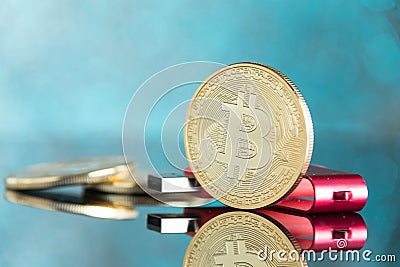 Gold digital cruptocurrency coin pile bitcoin with red hardware Stock Photo