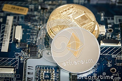 Gold Digital Cryptocurrency Coin Ethereum on Computer Motherboard. Crypto Currency Background. Editorial Stock Photo