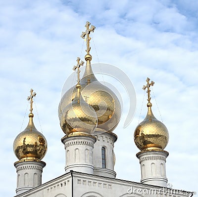 Gold domes of the Russian Orthodox Church on the background of blue sky. Russia. Siberia Stock Photo