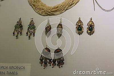 Gold earrings with precious stones. Period of Ancient Rome. Exhibit of the Heraklion Archaeological Museum Editorial Stock Photo