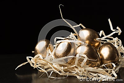 Gold Easter eggs on a black background Stock Photo