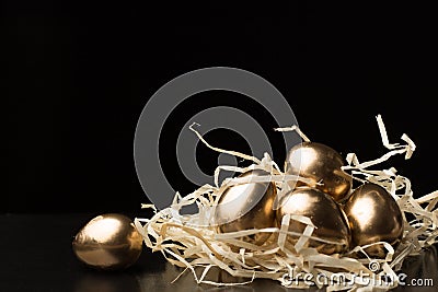 Gold Easter eggs on a black background Stock Photo