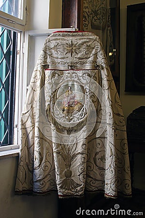 Gold-embroidered church vestment, mantle, Abbot's treasury in the Saint Mark Church in Korcula, Croatia Stock Photo