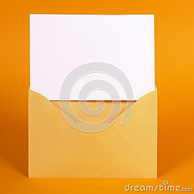 Gold envelope with blank message card Stock Photo