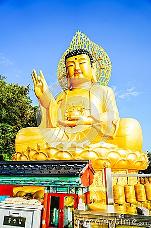 Gold Giant Buddha, Main Buddha Statue at Sanbanggulsa Temple, Sa Stock Photo