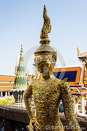 Gold giant statue at the Grand Palace temple of the Emerald Buddha in Bangkok Thailand Stock Photo