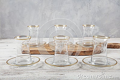 Gold gilded tea glasses. Turkish tea glass on white background Stock Photo