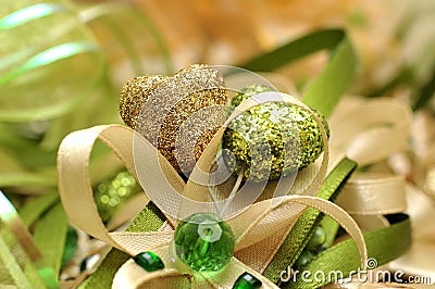 Gold and green heart with decorative bows Stock Photo