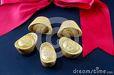 Gold ingot wedding Red ribbon bow wedding Chinese biack backgro Stock Photo