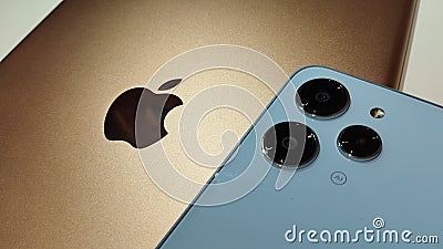 Gold iPad and Xiaomi Redmi 12 Sky Blue color. Editorial Stock Photo