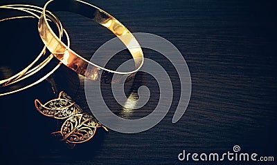 Gold jewelry placed on the table Stock Photo