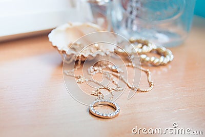 Gold jewelry and a shell Stock Photo
