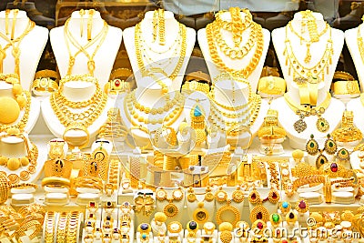 Gold jewelry in the window case of a jewelleries shop Stock Photo