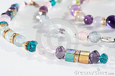 Gold jewerly braslete with semiprecious at white background Stock Photo