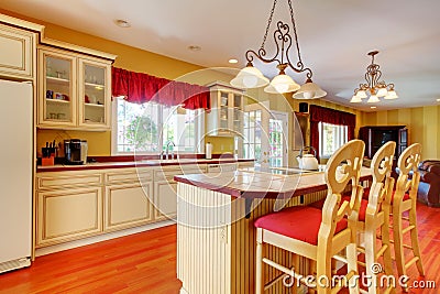 Gold kitchen with white antique cabinets. Stock Photo