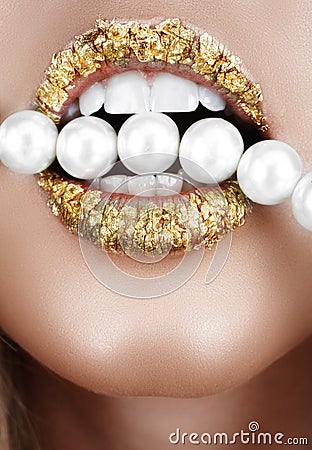 Gold leaf mouth with pearls Stock Photo