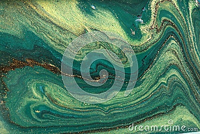 Gold marbling texture design. Green and golden marble pattern. Fluid art. Stock Photo