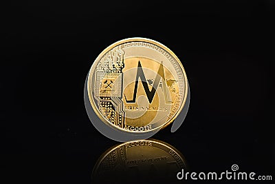 Gold MC COIN on a black background, cryptocurrency Editorial Stock Photo