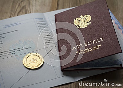 Gold medal and diploma of the graduate Stock Photo