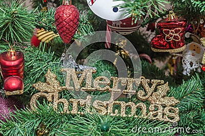 Gold Merry Christmas write, Christmas ornament tree, detail, close up Stock Photo