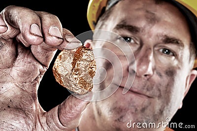 Gold miner with nugget Stock Photo