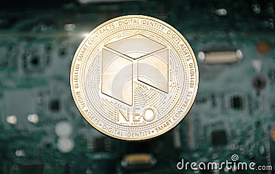 Gold neo coin, on background of computer motherboard Stock Photo
