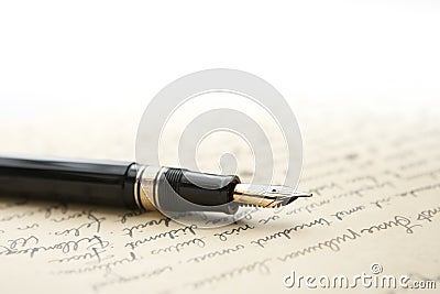 Gold Pen with Letter and Writing Stock Photo