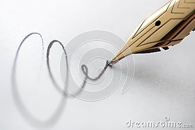 Gold pen with signature Stock Photo