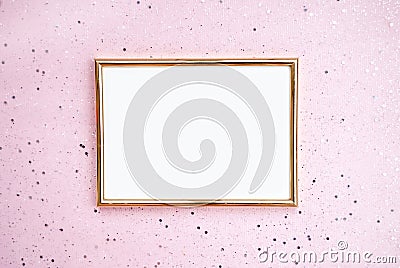 Gold photo frame, pink background with sparkles. Flat lat. Top view. Place for text Stock Photo