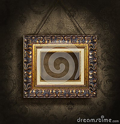 Gold picture frame on antique wallpaper Stock Photo